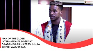 MAN  of  the Globe International  pageant Saadam Qaasim keessummaa Qophii Waamaraa