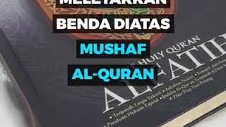 Hukum meletakkan benda lain diatas mushaf