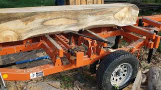 Woodmizer LT28 winch powered log turner.