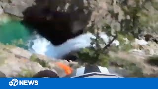 Motorcyclist survives terrifying fall from cliff