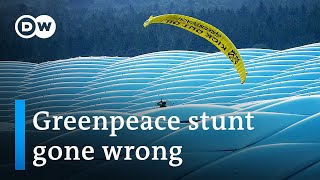 Greenpeace activist crashes Euro game in paraglider | DW News