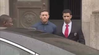 UNSEEN: Conor Mcgregor leaving jail house in handcuffs on way to court