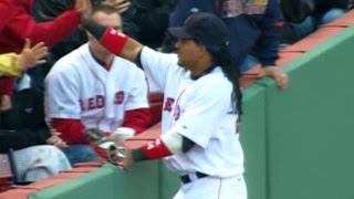 Ramirez makes the catch and high-fives a fan