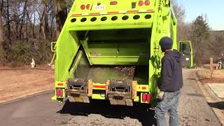 710000: GFL Autocar ACX PowerTrak On Yard Waste Piles