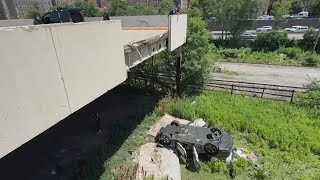 Car plunges through wall of Bronx parking deck