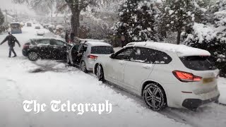Snow chaos: Out of control cars crash amid further weather warnings