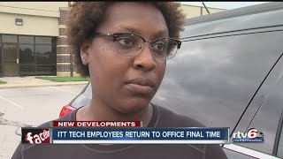 ITT Tech employees collect things from closing school