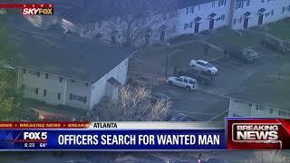 Officers search for wanted man