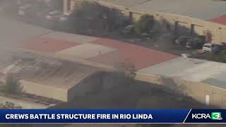LiveCopter 3 is over Rio Linda as crews battle a structure fire on Friday