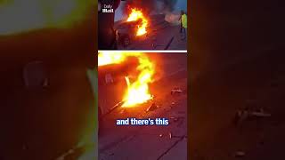 Police officer and off-duty fireman pull woman from burning car