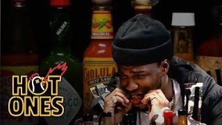 Curren$y Talks Munchies, Industry Games, and Rap Dogs While Eating Spicy Wings |