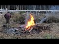 burning dead bamboo while watching for wind preparing the field to proceed with safety first.