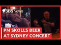 Anthony Albanese downs a beer in front of Sydney concert-goers | SBS News