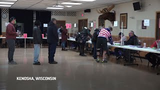 Divided Wisconsin voters cast their ballots