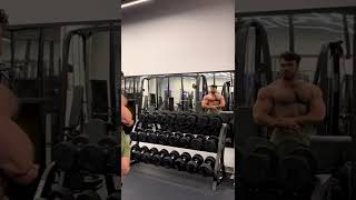 Hairy bodybuilder quick flex in the gym