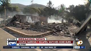 Couple narrowly escapes Alpine fire; Watches home burn