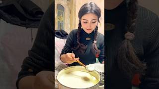 Village Life: Uyghur Girl Savors Traditional Fried Bread with Yogurt