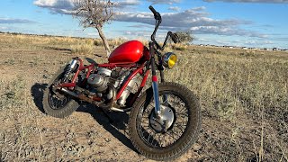 riding an old Ural motorcycle