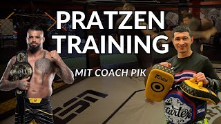 Pad training with Muay Thai Coach Kru Pik