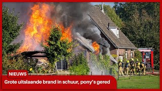 Grote uitslaande brand in grote schuur in Didam