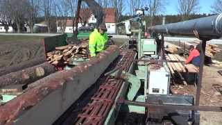 Mobile sawmill on a truck with a blade and movable saw table a man's job that takes care of everythi