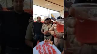 IGP VK Birdi distributing water to the Azaadars on 10th Muharram procession in Alamgari Bazar