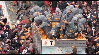 FOOD FIGHT: Thousands gather in Ivrea, Italy to pummel each other with 1.1 million pounds of oranges
