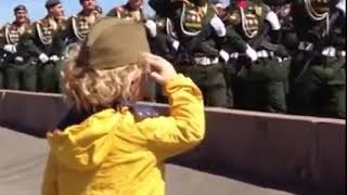 Cute Soldiers saluting a boy Victory Day Parade Moscow