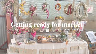 Market preparation, hand tied bouquets and new hair