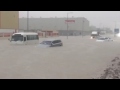 cars stuck at a flooded street in jebel ali industrial area