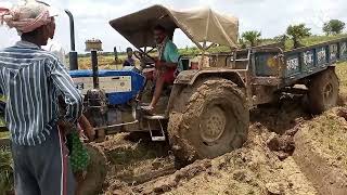 Swaraj 744 FE tractor stuck in mud with trolley