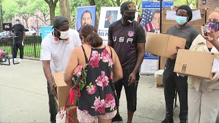 Hundreds line up in Harlem for free groceries; Korey Wise of the Exonerated Five lends a hand