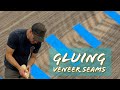 Gluing veneer seams.