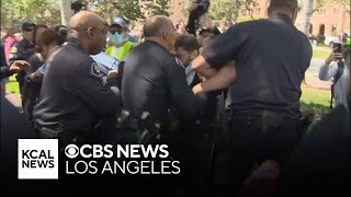 Pro-Palestinian protesters clash with campus police at USC's Alumni Park