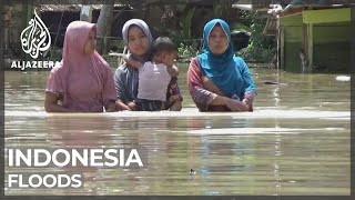 Indonesia floods force more than 20,000 to flee homes