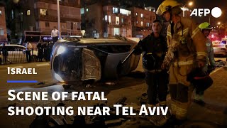 Israelis gather on site of an attack that killed five near Tel Aviv | AFP