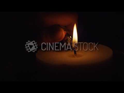 CinemaStock - B Roll & Stock Footage - Hand Lights Candle In Slow ...