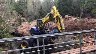 Spider Excavator walks into a canal