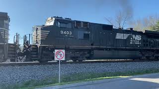 Conductor climbs on board NS 102 w/ 3 smoking dash 9’s leading