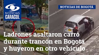 Ladrones asaltaron carro durante trancón en Bogotá y huyeron en otro vehículo que los esperaba