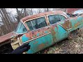 photographing old cars in the woods