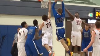 Texas Titans G/F Mickey Mitchell attacks the rim with a monster jam.