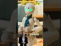 In Tokyo, there is an unusual café with robot waiters operated by people with disabilities