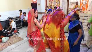 Indian women enjoy dancing to live music during Holi Utsav or Festival of Colours celebration