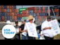 Port workers reach tentative deal, ending strike | USA TODAY