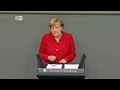 merkel walks tightrope on refugee policy dw news