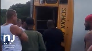 School bus flips on New Jersey Turnpike
