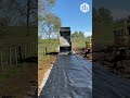 satisfying dump truck spreads gravel