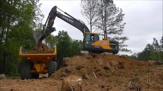 Excavator Loading Rock