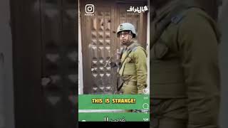 Israeli IDF soldiers find it funny knocking at a door to a residence that they've just desecrated.